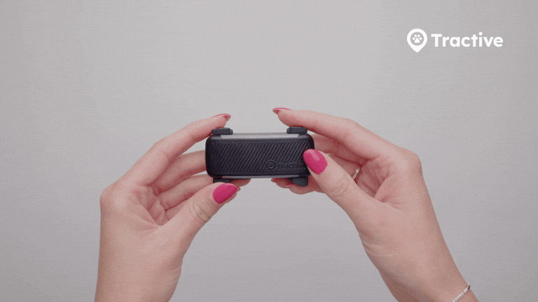 Animated GIF showing hands holding a DOG 6 tracker connected to a charging cable while repeatedly pressing the power button 10 times to perform a hard reset