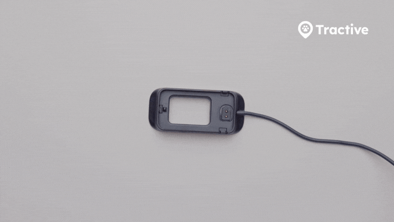 Animation demonstrating hard reset on Tractive CAT Mini: tracker placed in charger, power button pressed 10 times, LED blinking red then white to confirm reset